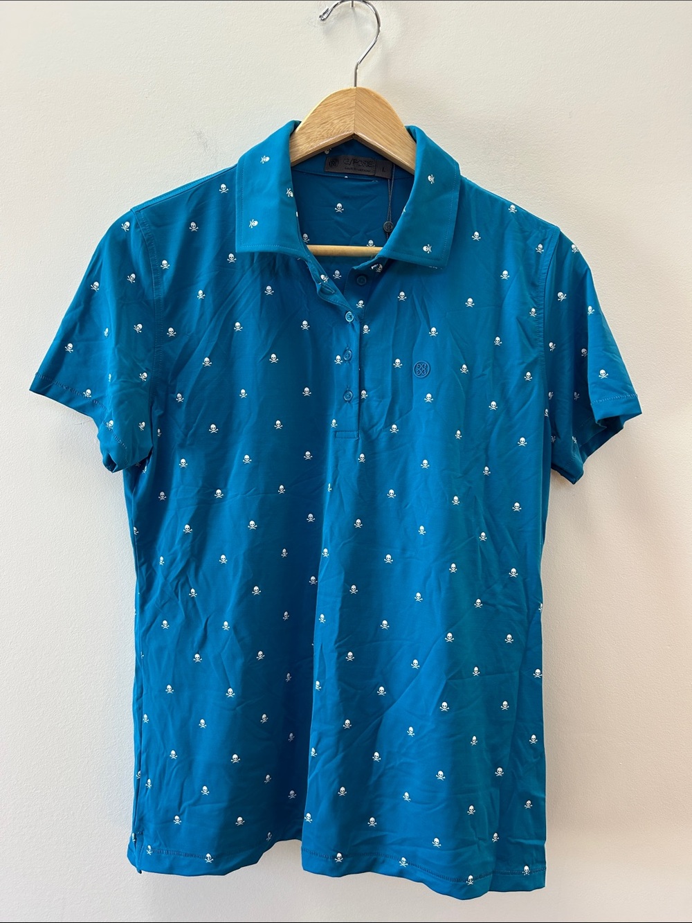 G/FORE Blue Polo with Mini White Skull Motif